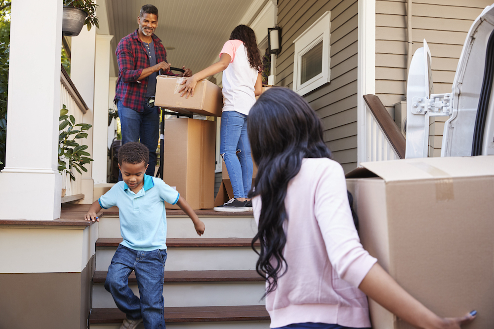 children helping their parents move into a new house